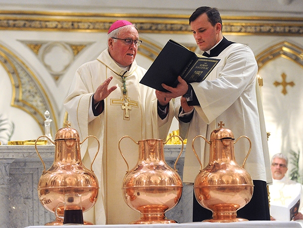 Bishop Richard J. Malone blessed the Holy Oil at St. Joseph Cathedral at the Chrism Mass. The Holy Oil will be distributed to area churches. (Dan Cappellazzo/Staff Photographer)